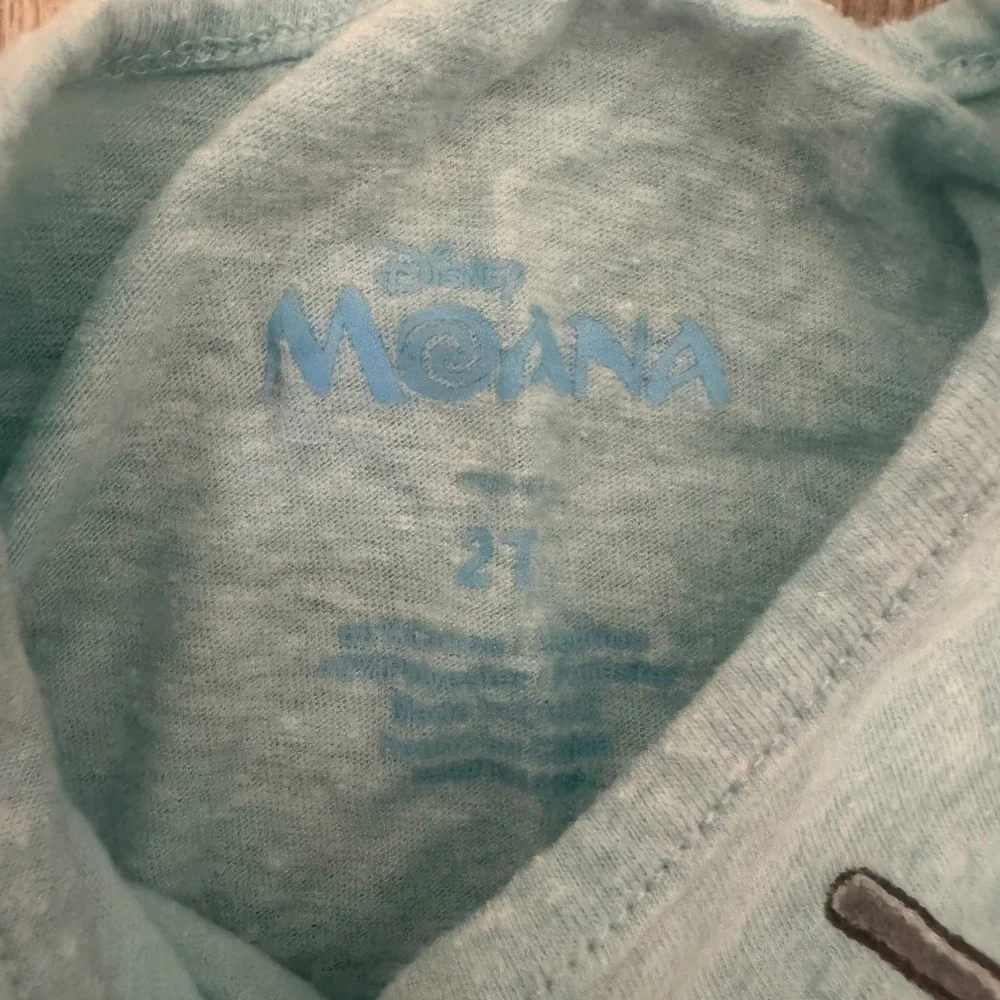 Disney Light Blue Moana Graphic Tee with Gold Accents